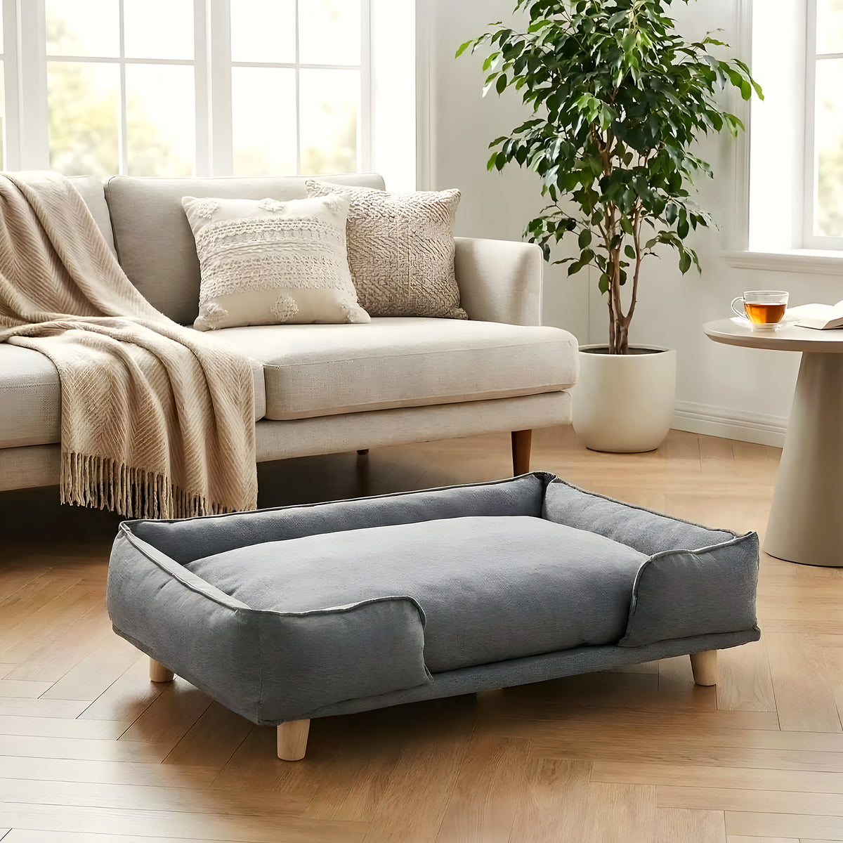 Canapé lit sur pieds en bois avec coussin pour chien